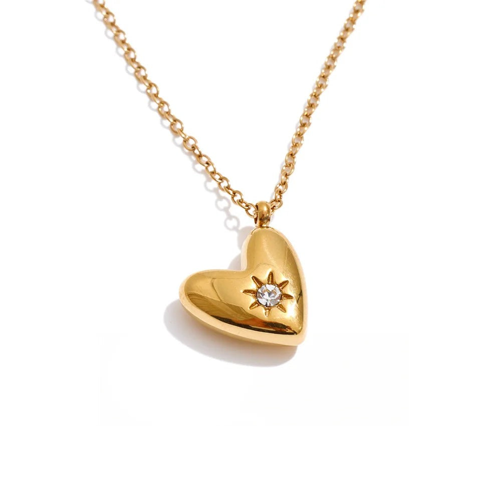 Gold-plated stainless steel necklace with cubic zirconia heart pendant.