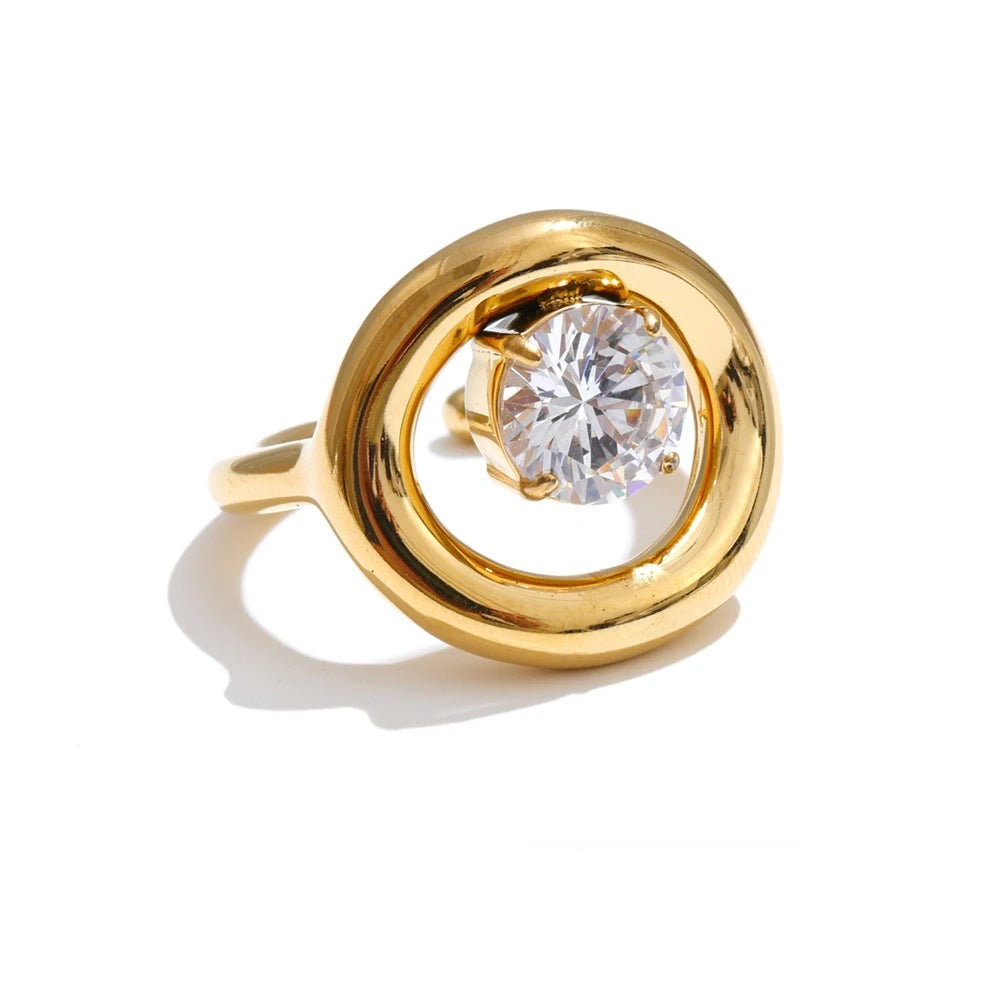Gold-plated ring with cubic zirconia in center.