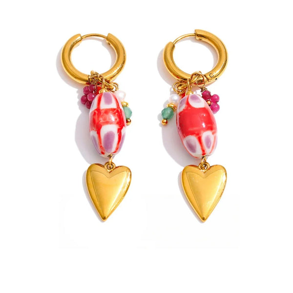 Gold-plated heart earrings with red and white beads.