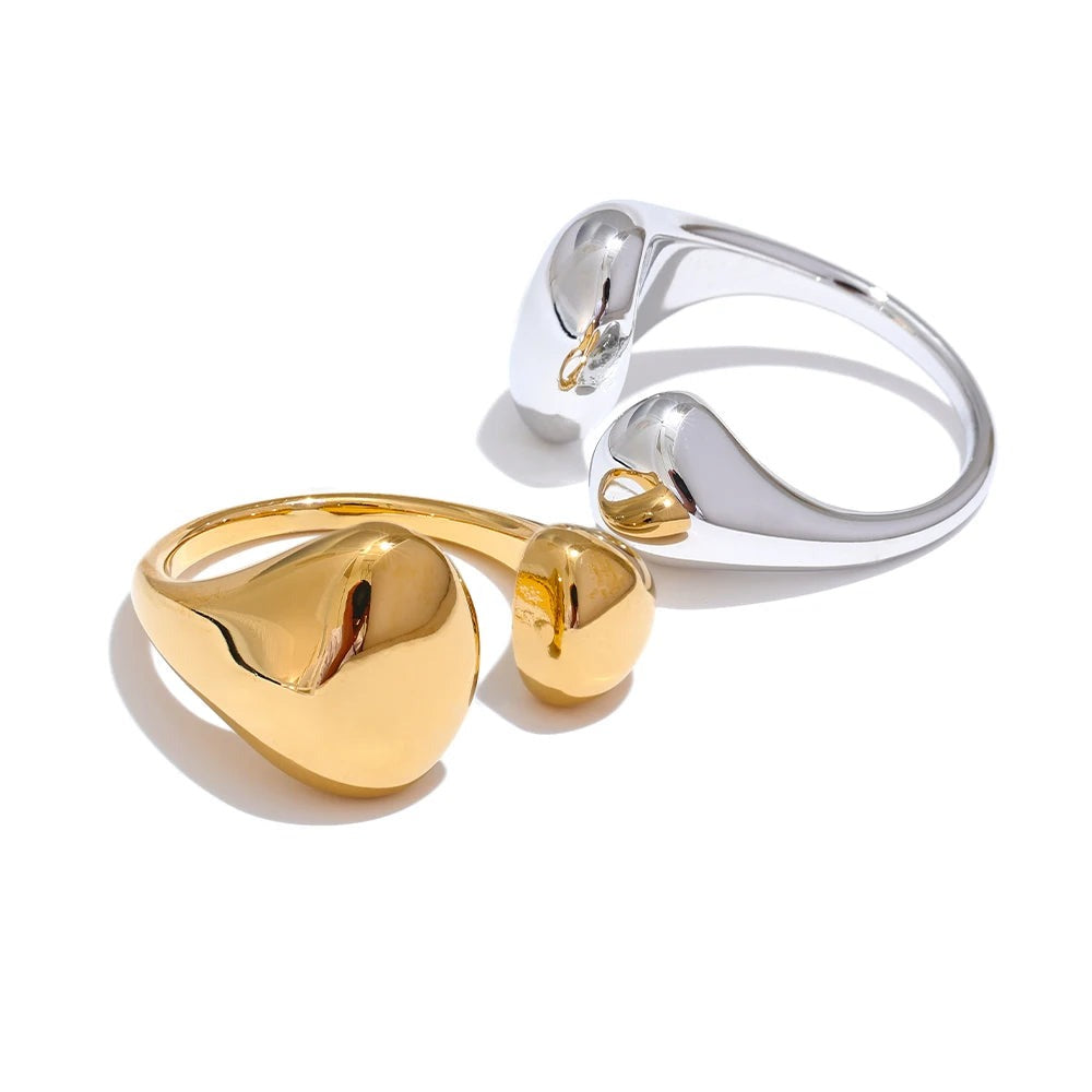 Gold-plated stainless steel ring with a heart shape on top.