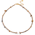 Freshwater pearl natural stone beaded necklace in gold-plated stainless steel with freshwater pearl and natural stone.