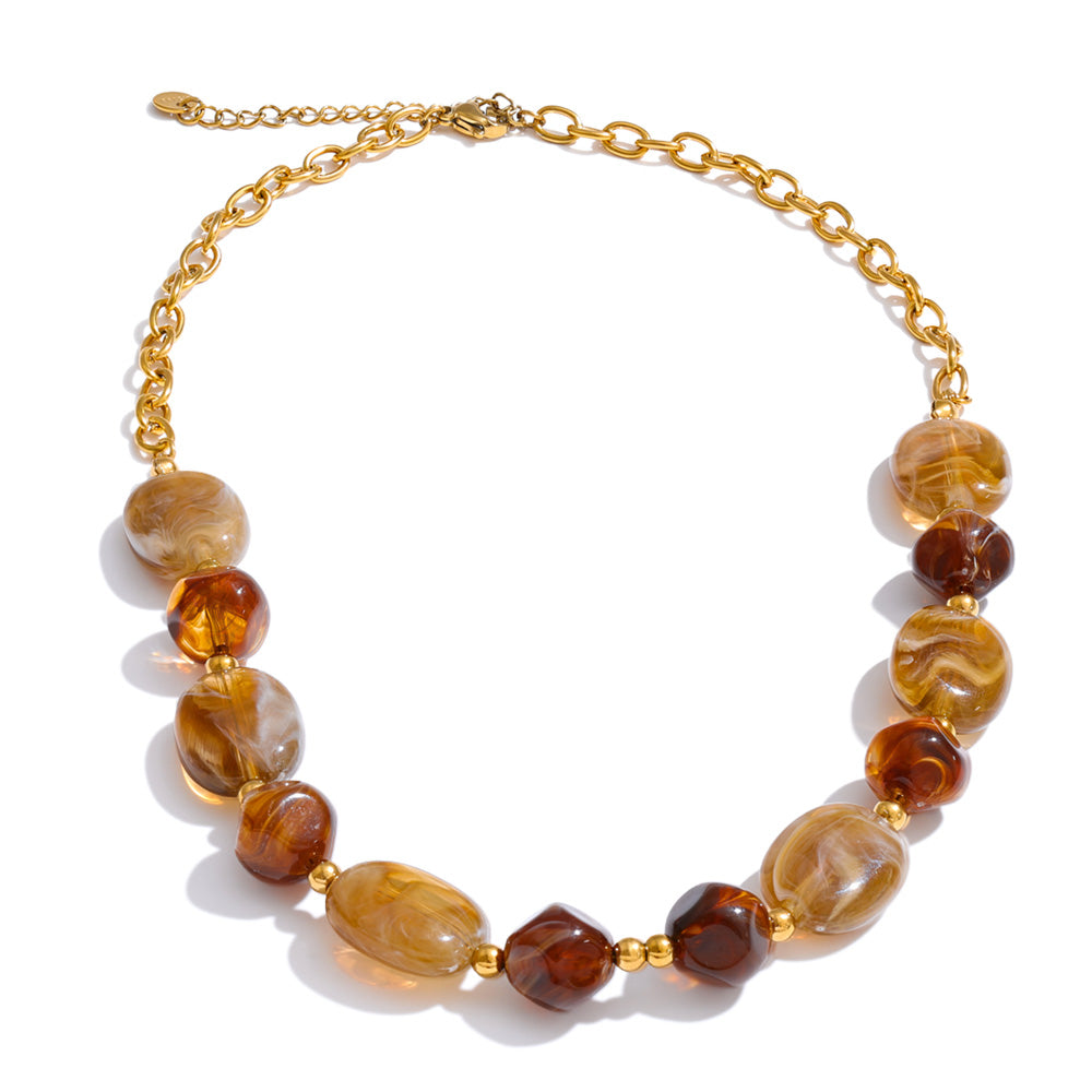 Resin beaded geometric necklace in gold-plated stainless steel with resin.