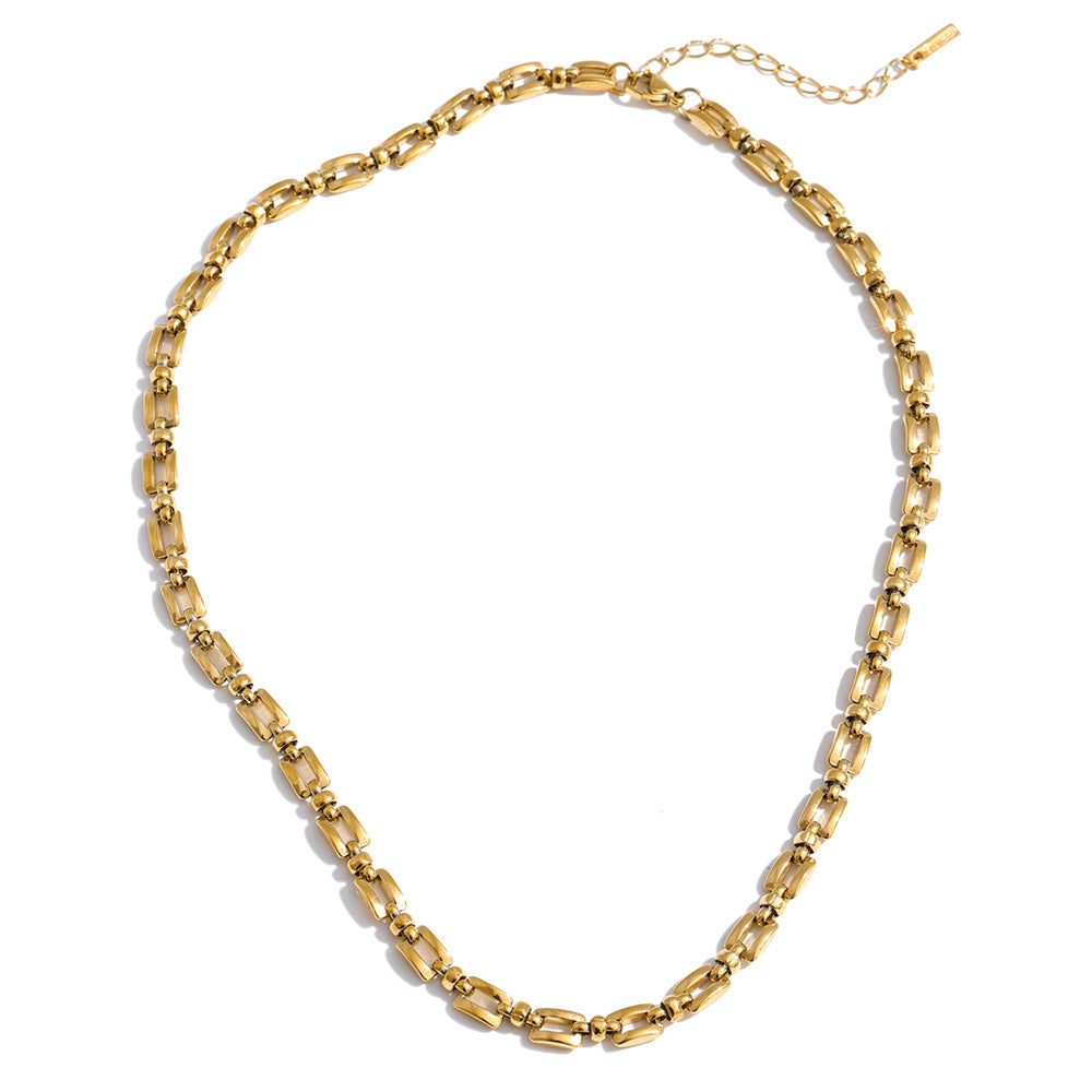 Geometric chain necklace in gold-plated stainless steel.