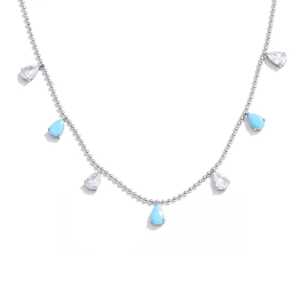 Gold-plated stainless steel necklace with cubic zirconia stones and blue accents.