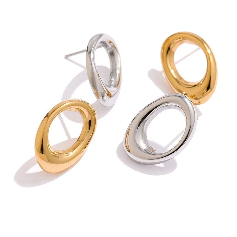 Gold-plated stainless steel hoop earrings with a large oval shape.