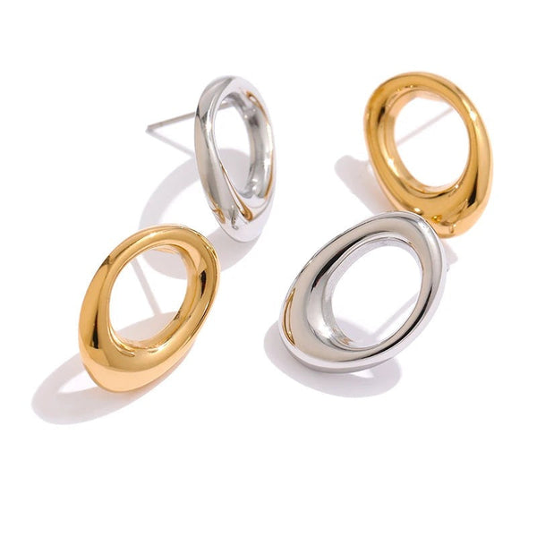 Gold-plated stainless steel hoop earrings with a large oval shape.