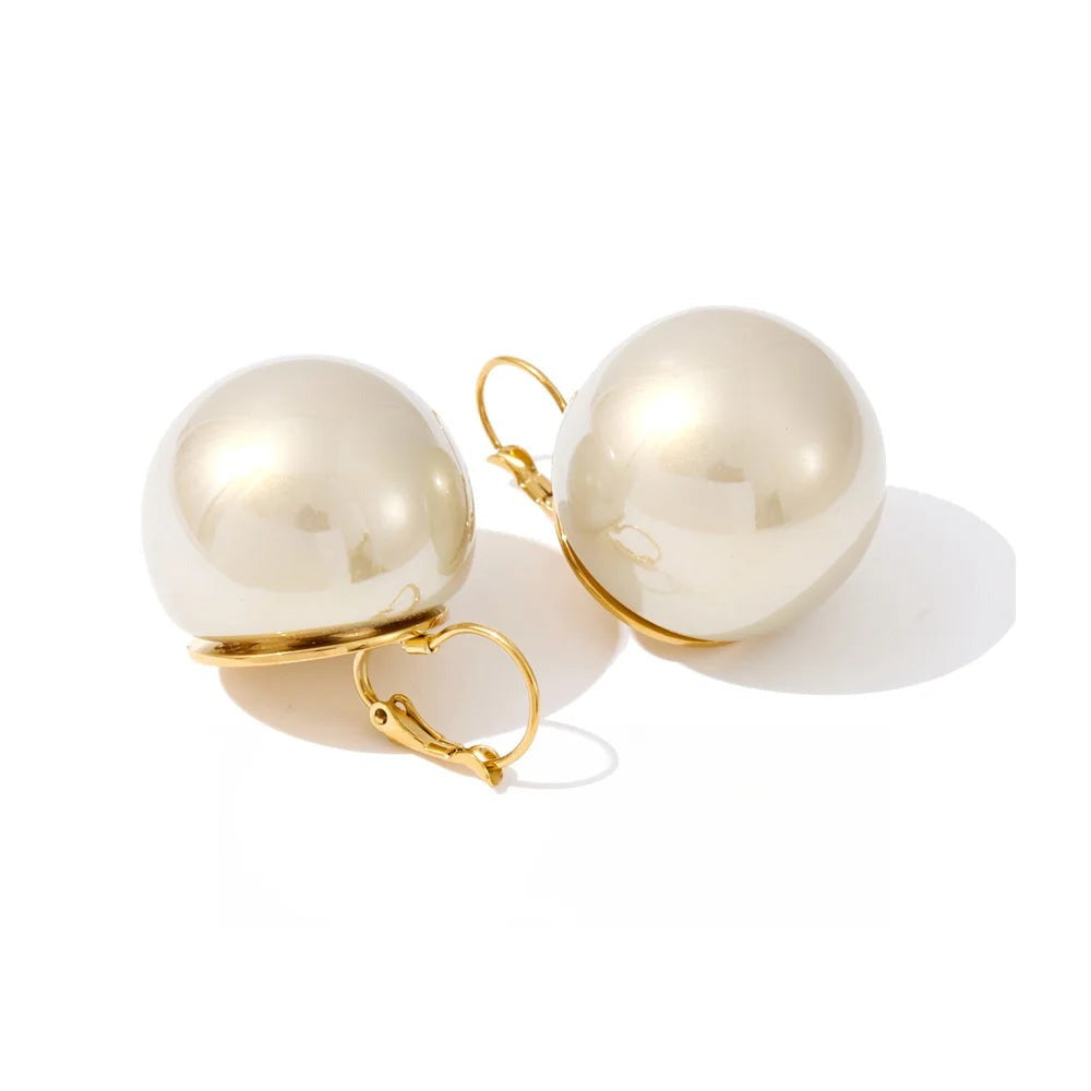 Gold-plated pearl earrings.