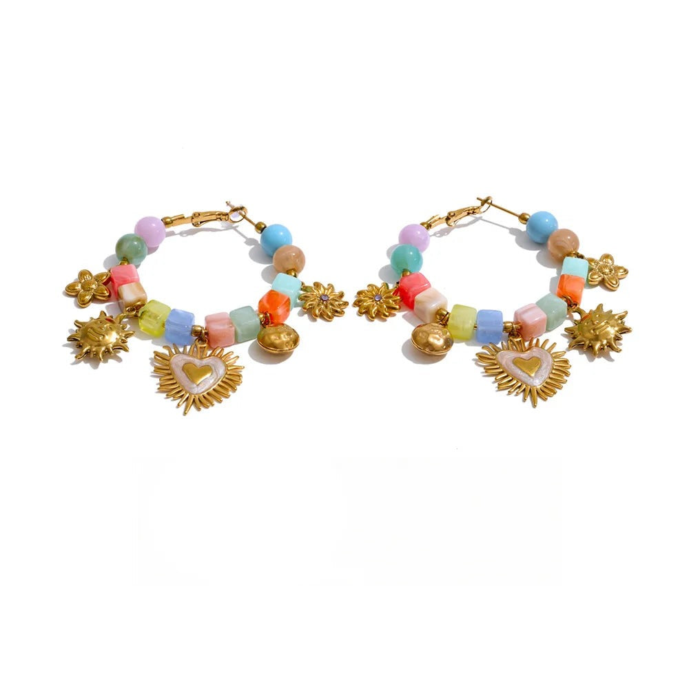 Gold-plated stainless steel earrings with resin and acrylic.