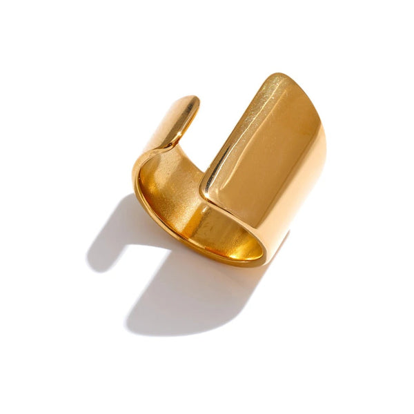Gold-plated stainless steel ring with a unique, curved design.