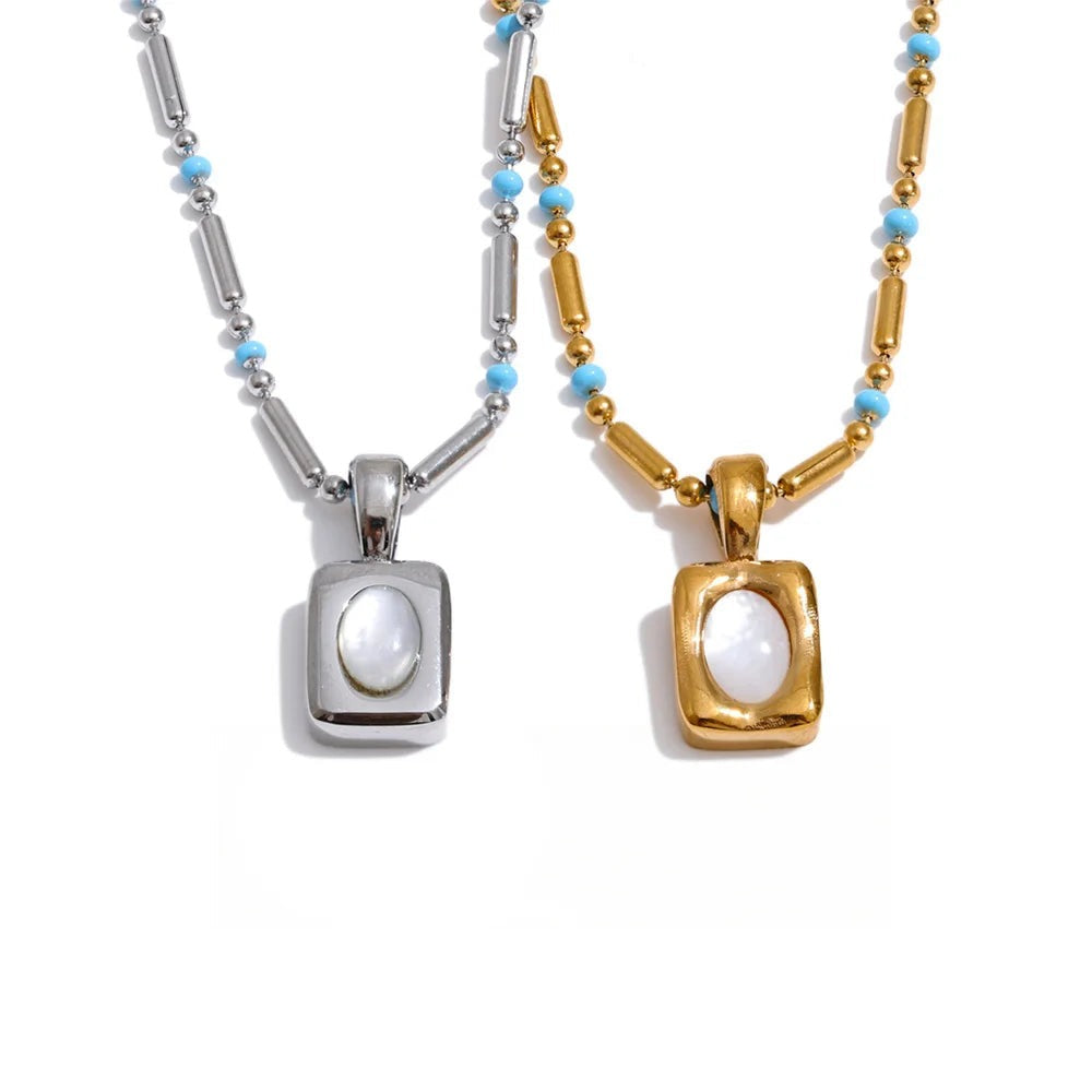 Gold-plated stainless steel necklace with shell pendant.