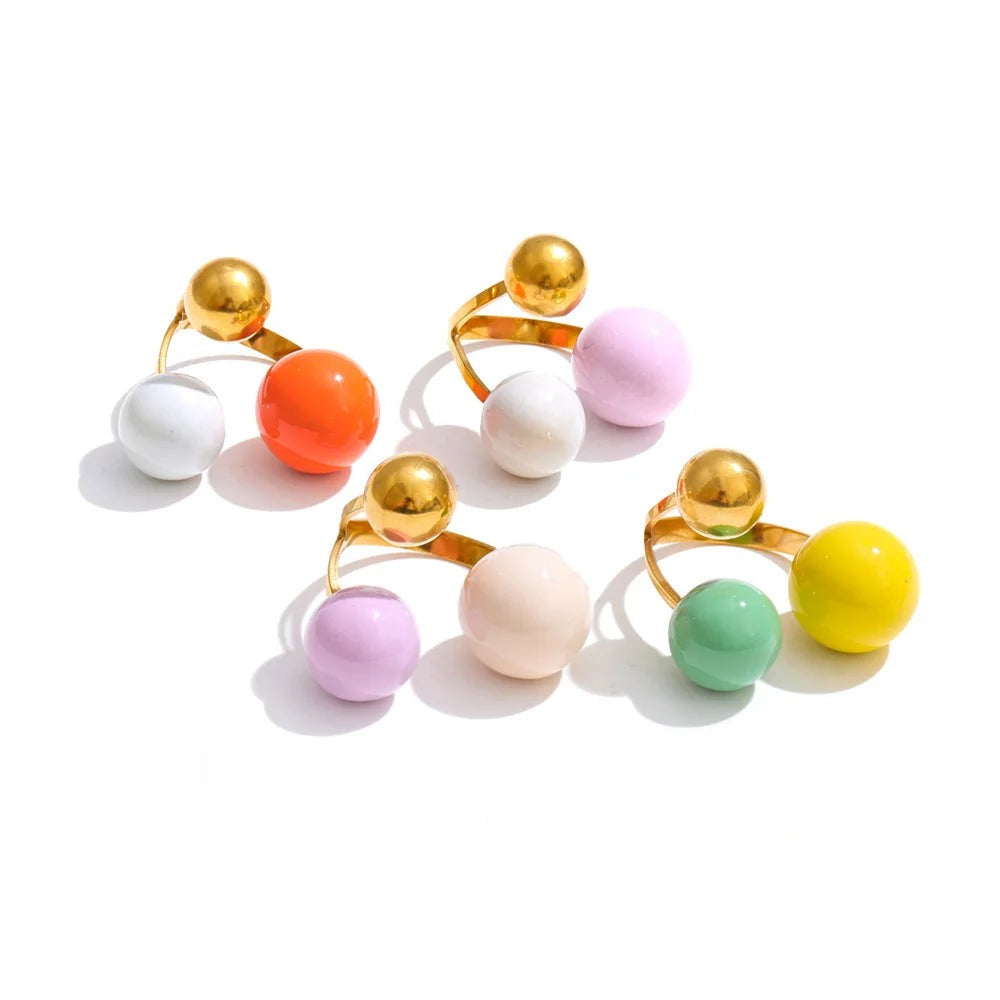 Gold-plated stainless steel ring with enamel balls.