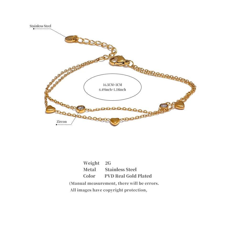 Cubic zirconia heart chain necklace in gold-plated stainless steel with cubic zirconia.