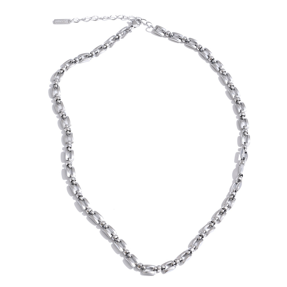 Geometric chain necklace in gold-plated stainless steel.