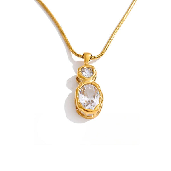 Gold-plated stainless steel necklace with cubic zirconia pendant.