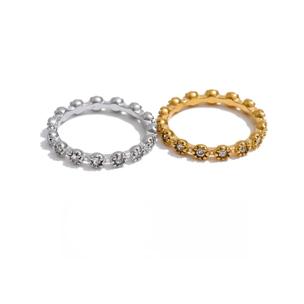 Gold-plated stainless steel ring with cubic zirconia.