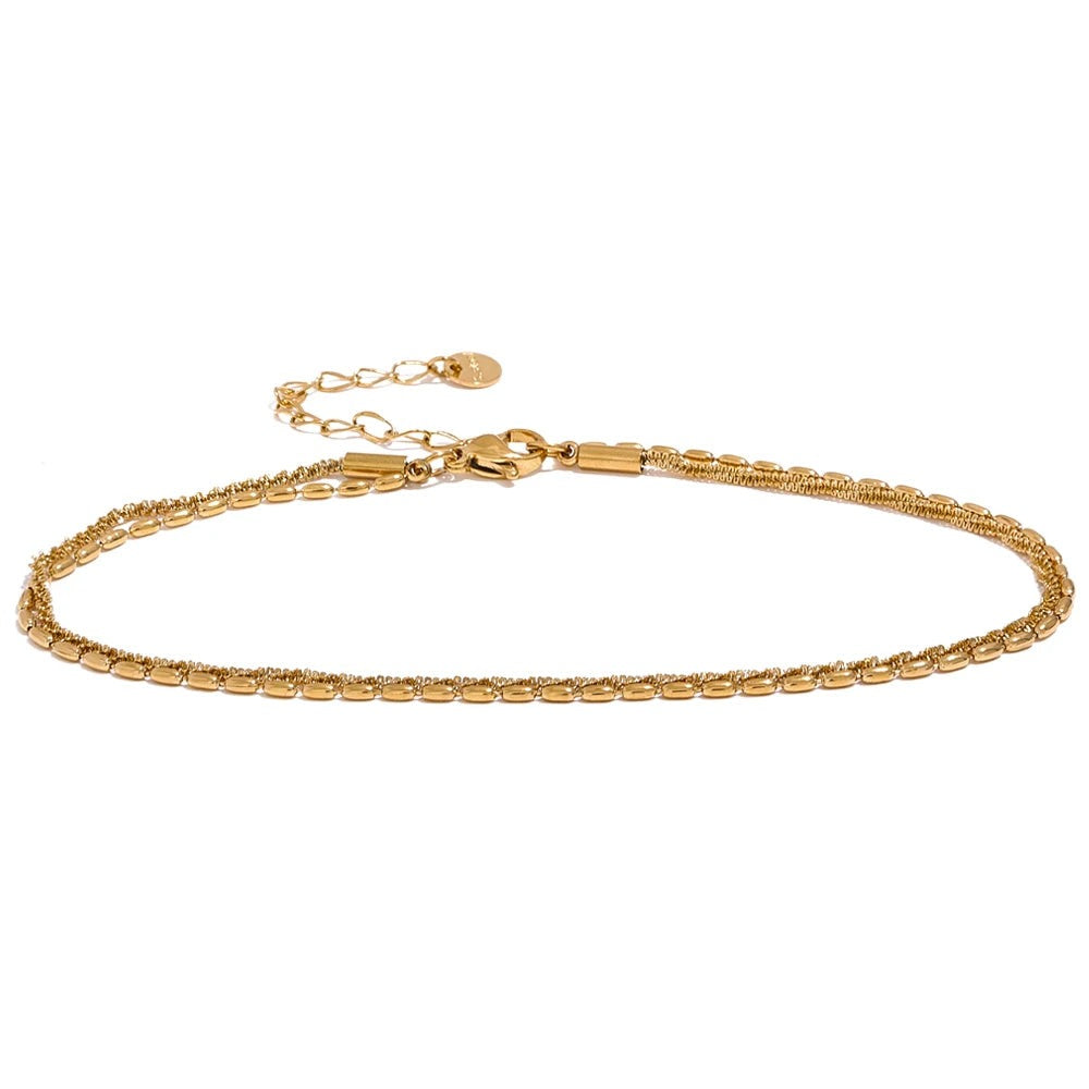 Gold-plated stainless steel anklet with a chain link bracelet.