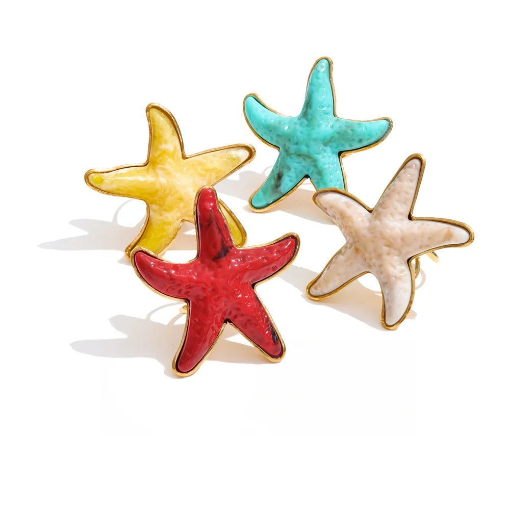 Gold-plated stainless steel starfish ring with red, blue, and yellow resin finish.
