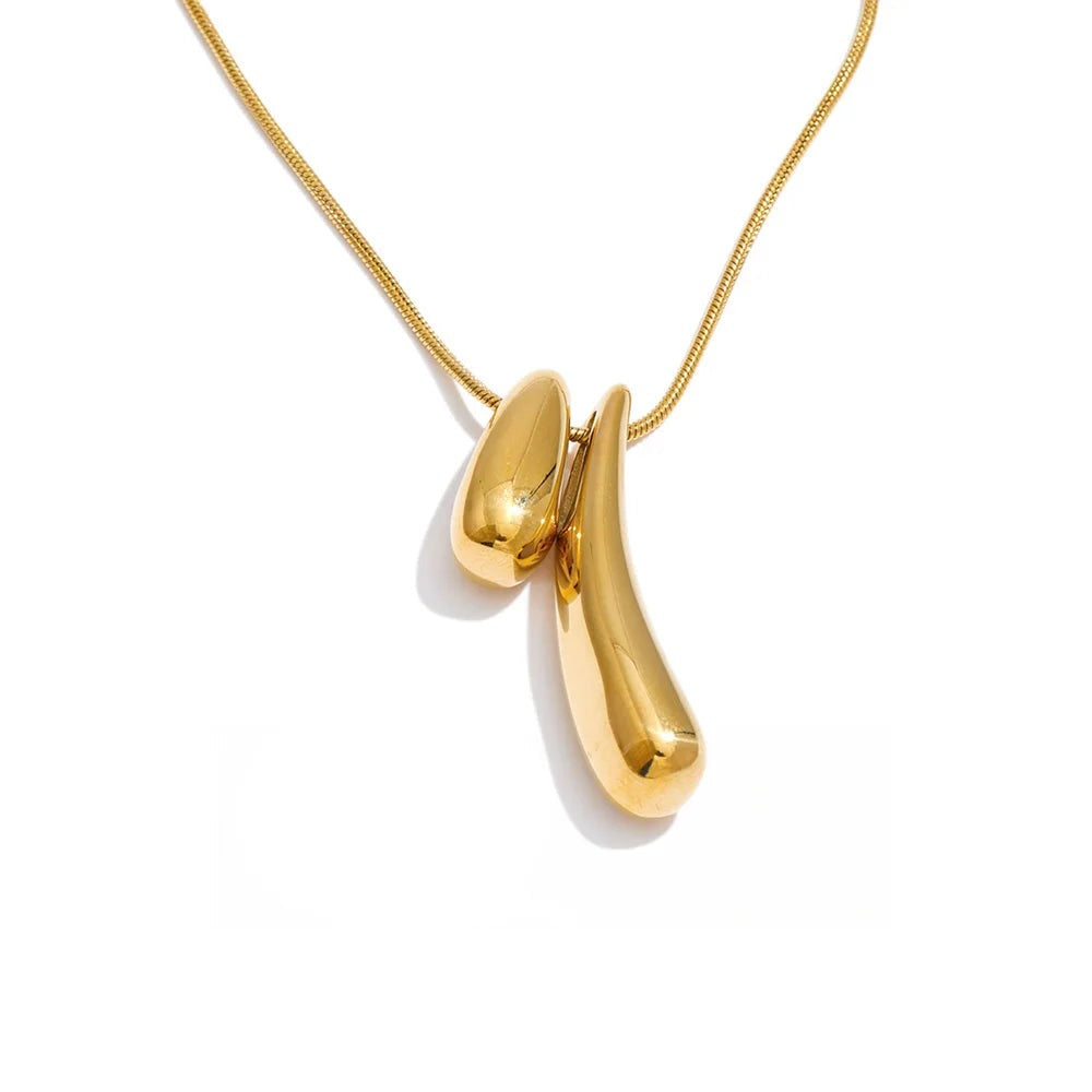 Gold-plated stainless steel necklace featuring a large gold-plated shoe pendant.