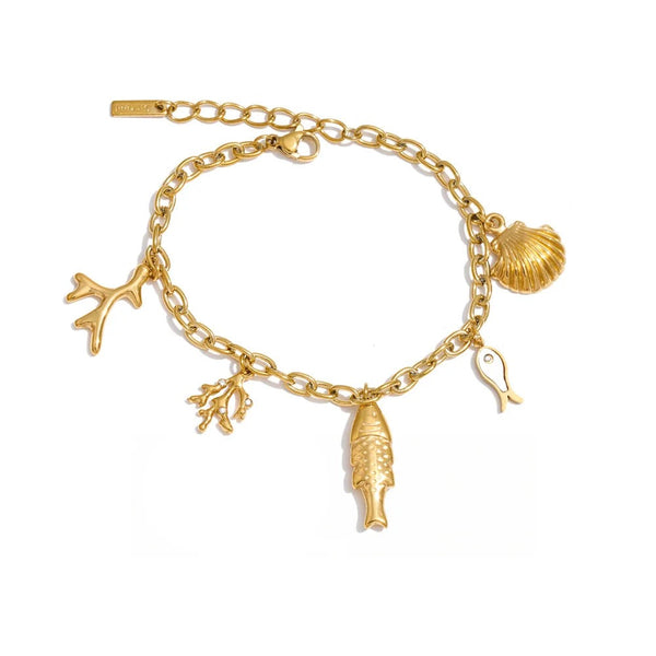 Gold-plated bracelet with shell charm featuring a fish, dolphin, and seaweed.