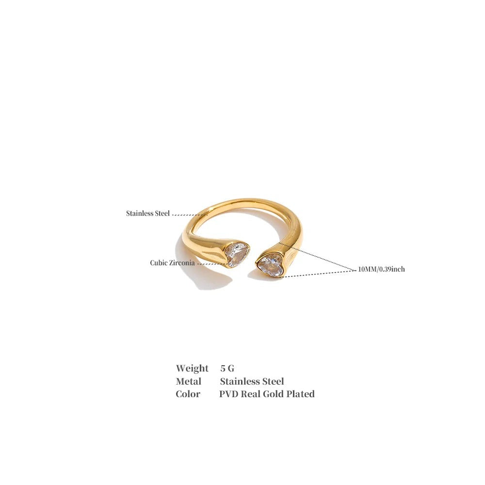 Cubic zirconia heart ring in 18K gold-plated stainless steel with cubic zirconia.