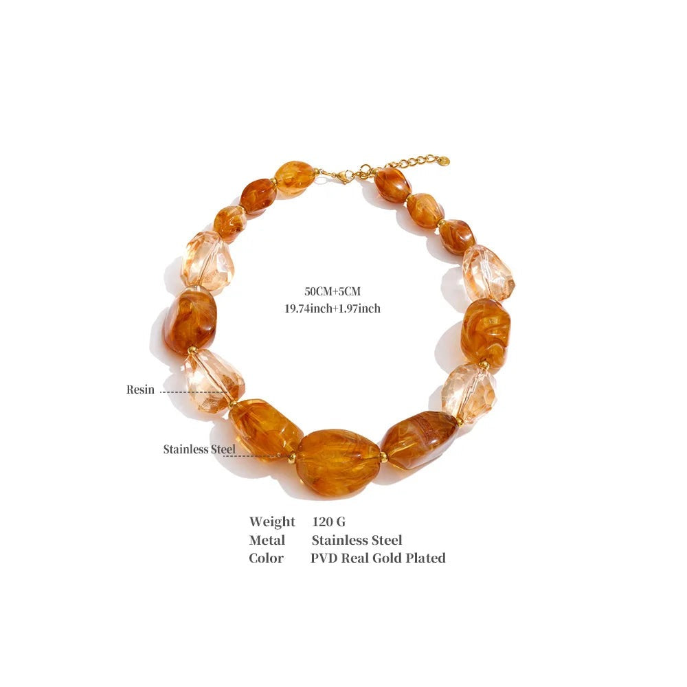 Resin acrylic geometric necklace in gold-plated stainless steel with resin and acrylic.