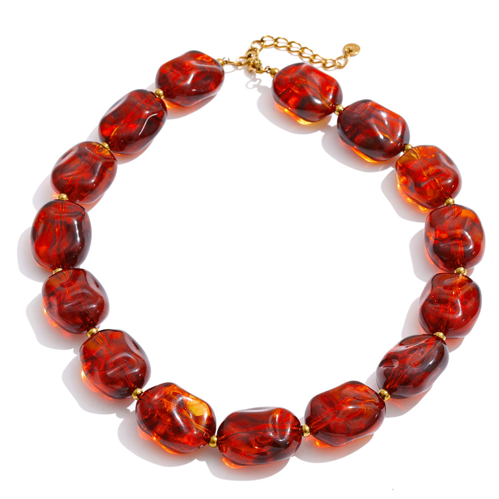 Amber resin acrylic necklace in gold-plated stainless steel with resin and acrylic.