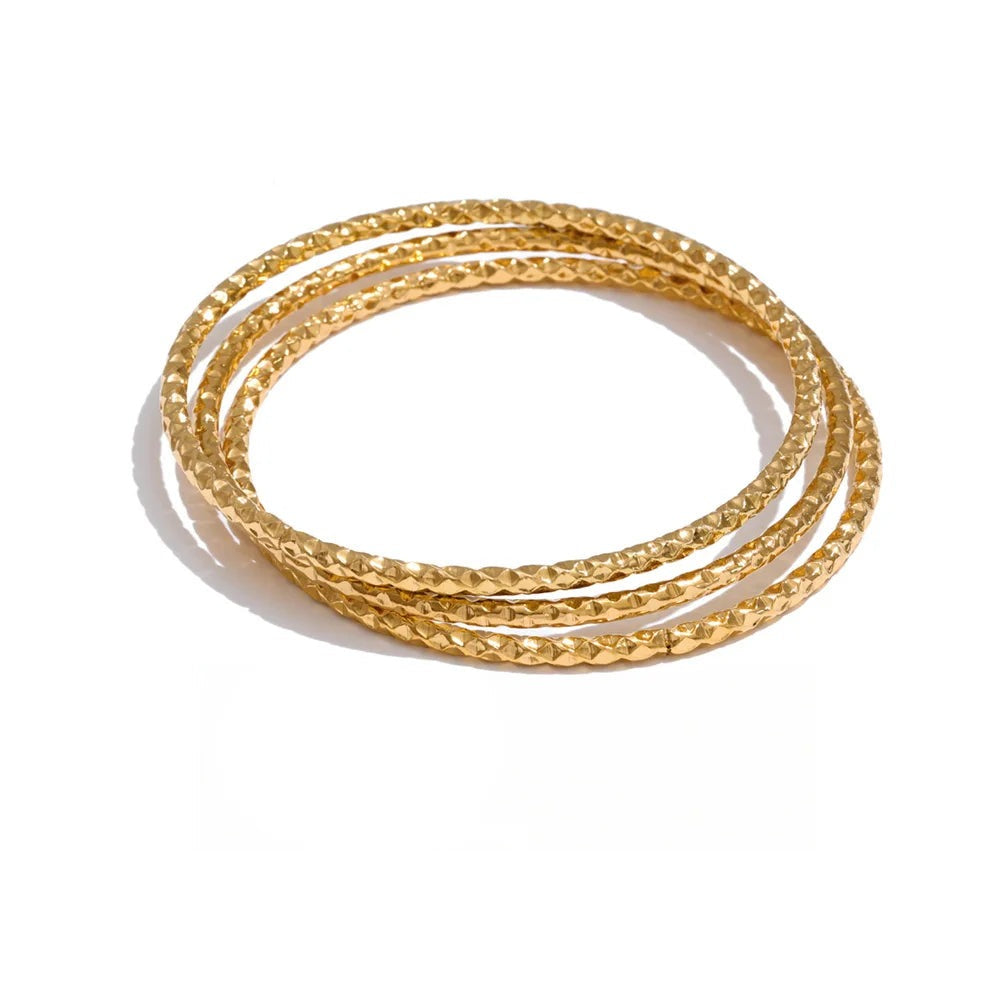 Gold-plated bracelet with multiple loops.