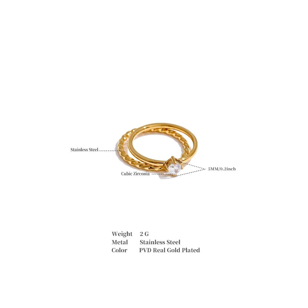 Cubic zirconia geometric ring in gold-plated stainless steel with cubic zirconia.