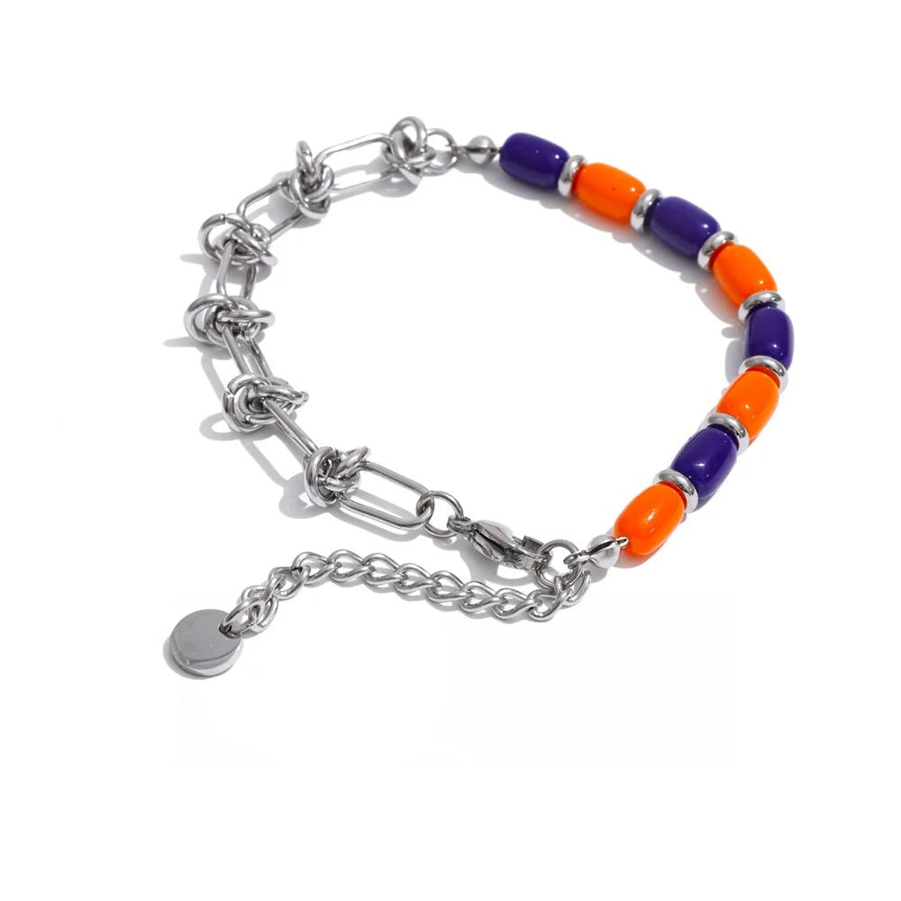 Gold-plated stainless steel bracelet with orange and blue resin beads.