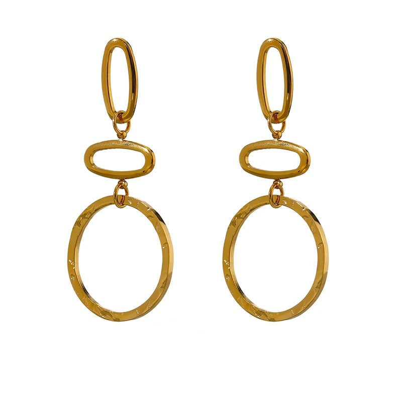 Gold-plated stainless steel earrings with large hoop design.
