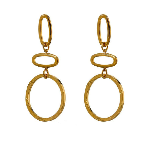 Gold-plated stainless steel earrings with large hoop design.