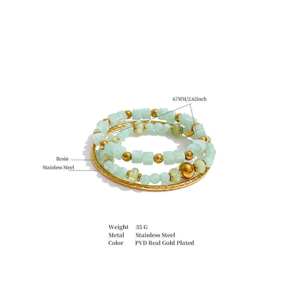Resin acrylic beaded bracelet in gold-plated stainless steel with resin and acrylic.