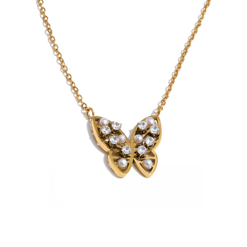 Gold-plated stainless steel necklace with pearl and cubic zirconia accents featuring a butterfly design.