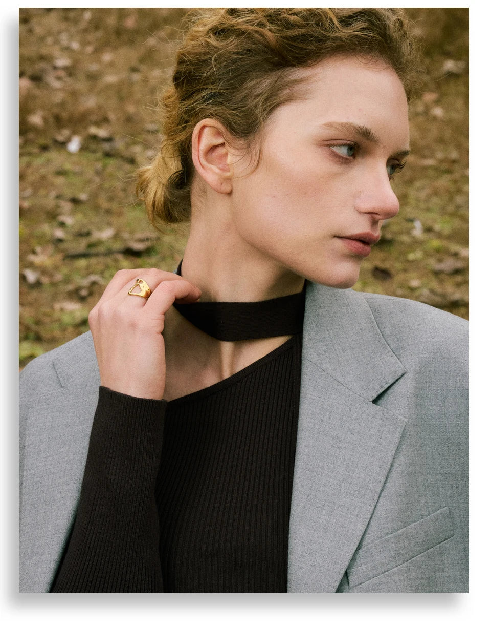Geometric ring in gold-plated stainless steel.