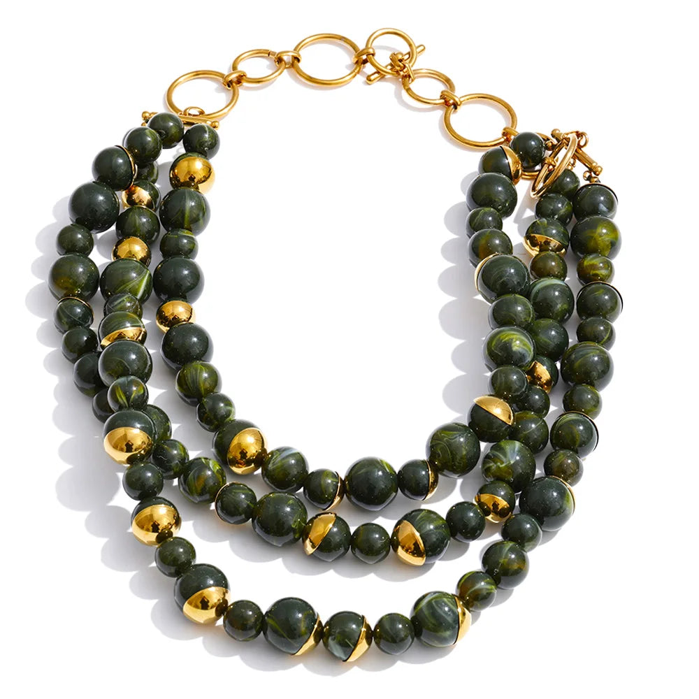 Pearl beaded geometric earrings in gold-plated stainless steel with pearl.