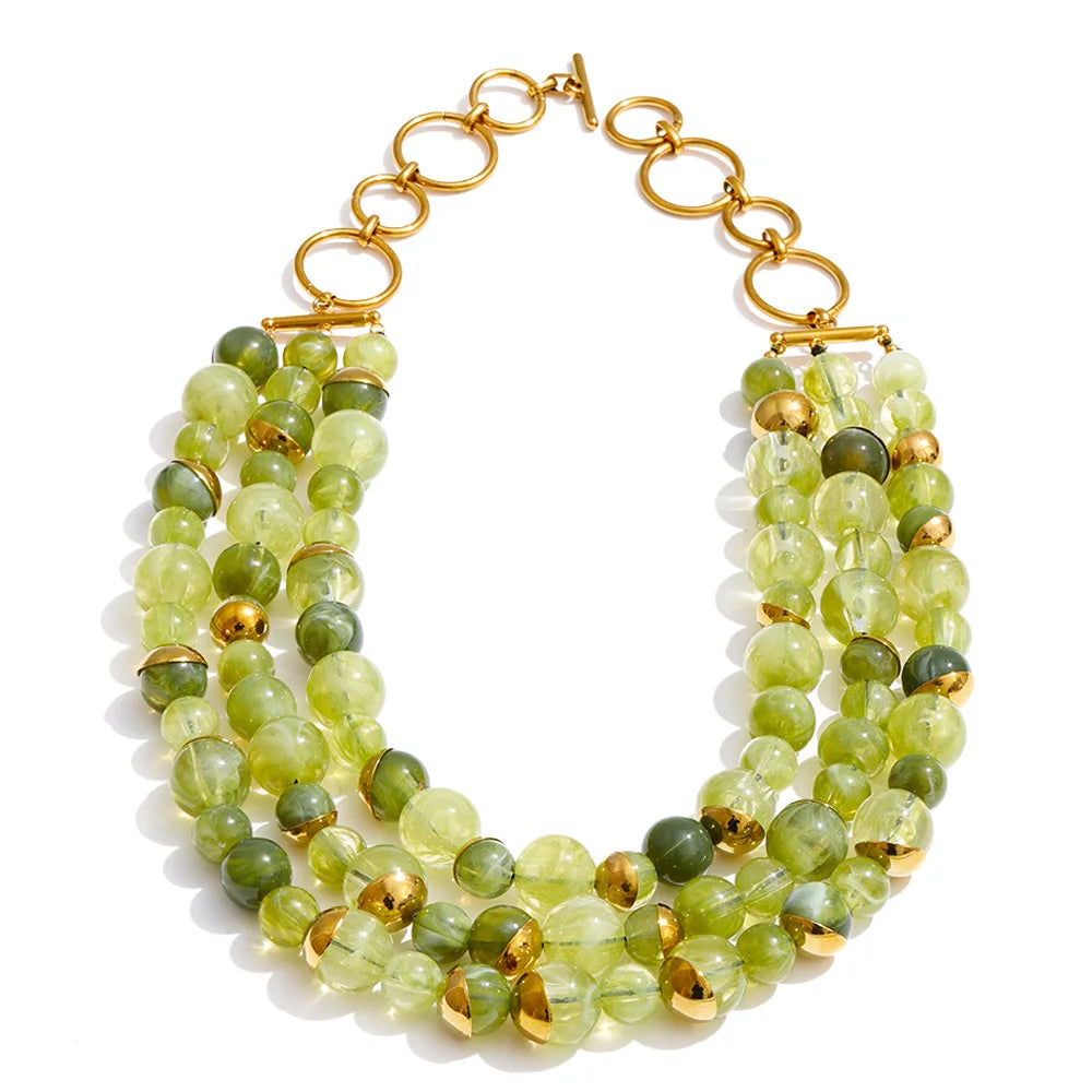 Pearl beaded geometric earrings in gold-plated stainless steel with pearl.