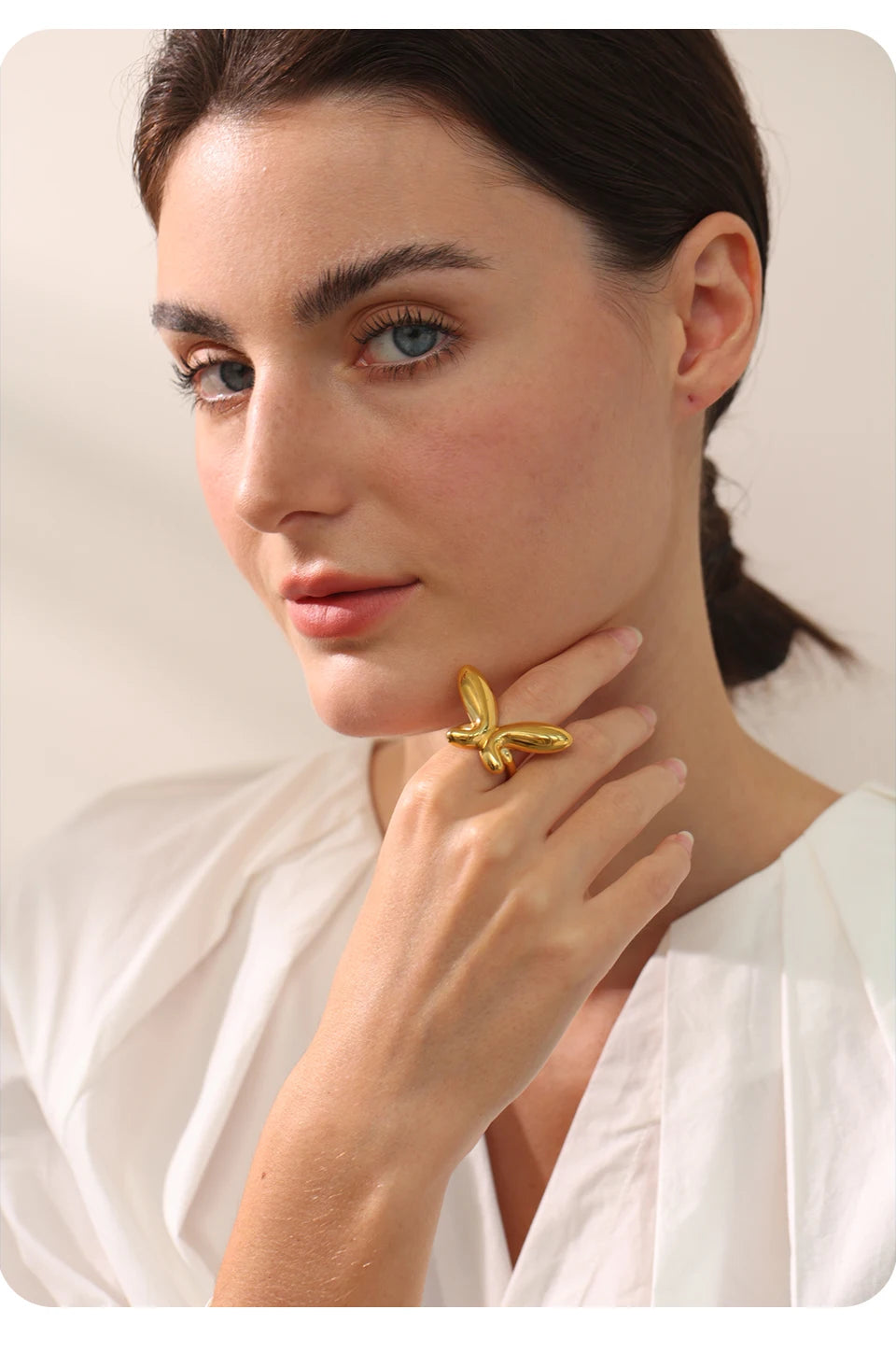 Butterfly minimalist geometric ring in 18K gold-plated 316L stainless steel.