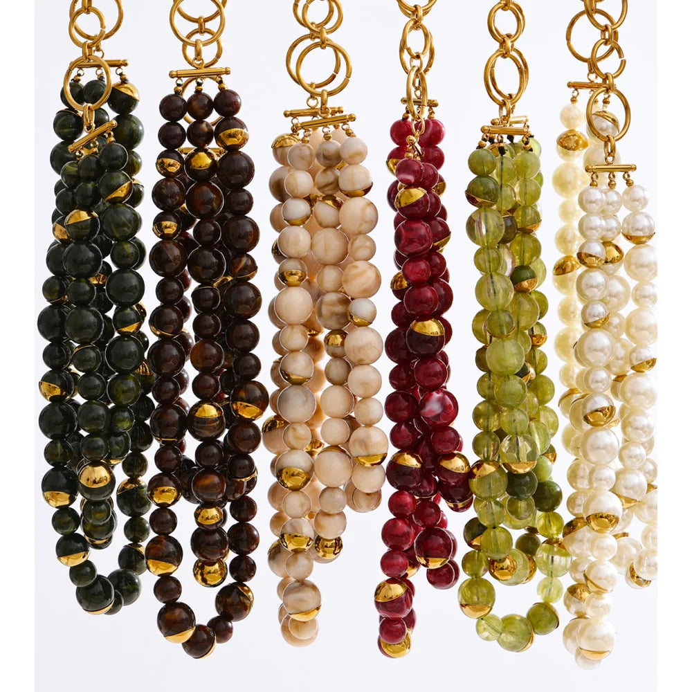 Pearl beaded geometric earrings in gold-plated stainless steel with pearl.