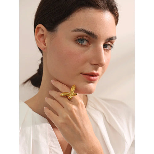 Butterfly minimalist geometric ring in 18K gold-plated 316L stainless steel.