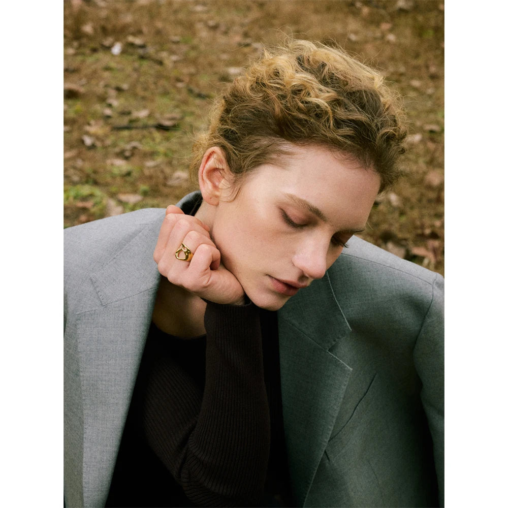 Geometric ring in gold-plated stainless steel.