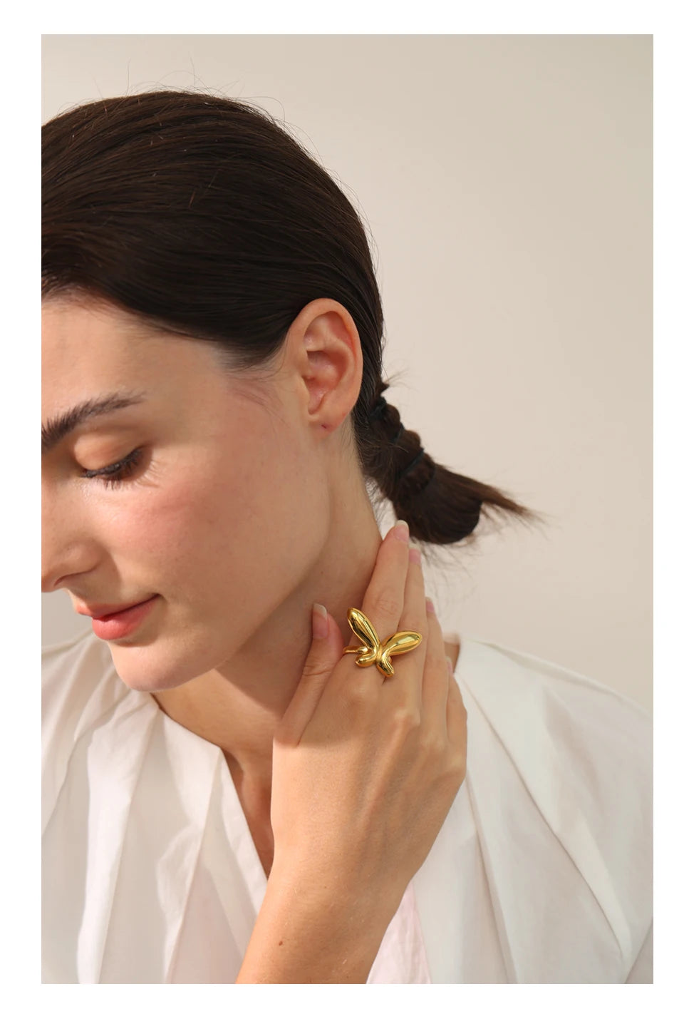 Butterfly minimalist geometric ring in 18K gold-plated 316L stainless steel.
