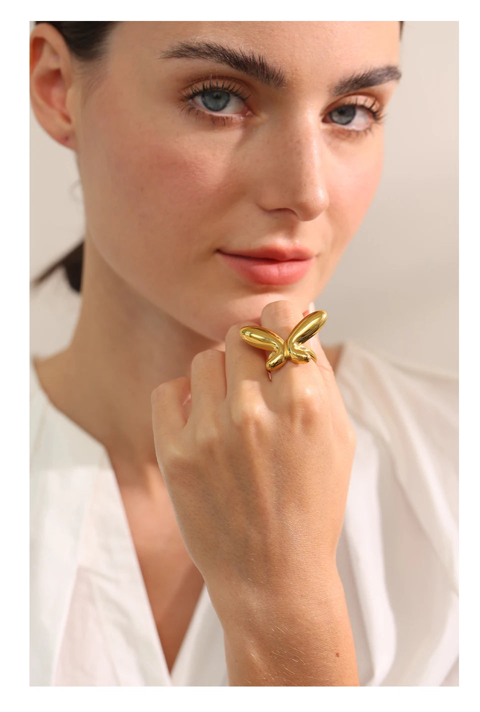 Butterfly minimalist geometric ring in 18K gold-plated 316L stainless steel.