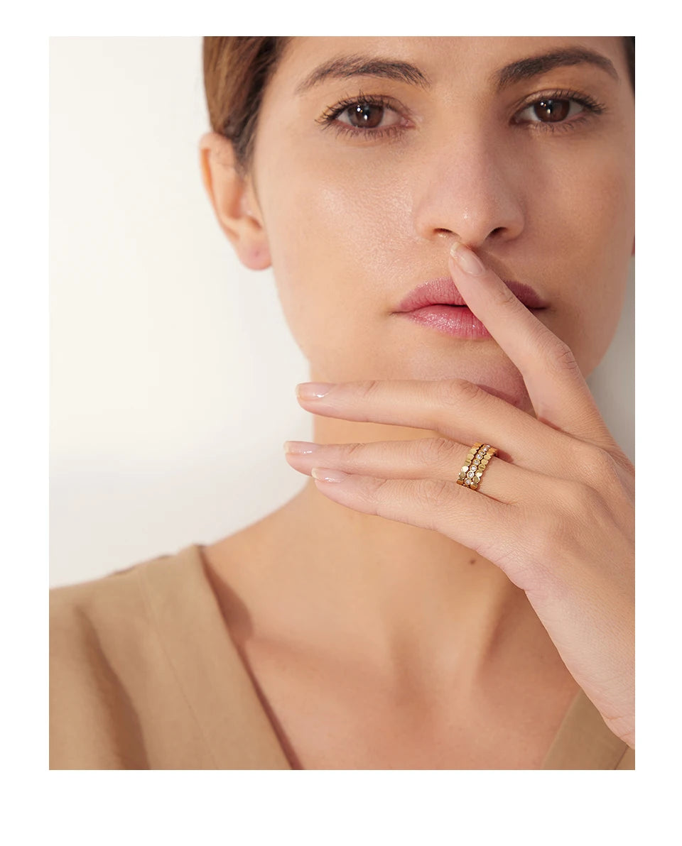 Cubic zirconia geometric ring in 18K gold-plated 316L stainless steel with cubic zirconia.