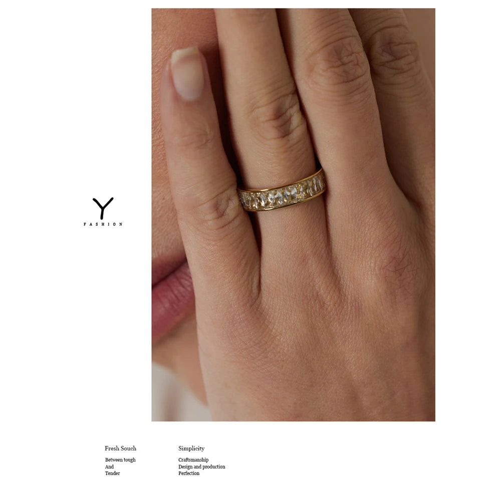 Cubic zirconia geometric ring in 18K gold-plated stainless steel with cubic zirconia.
