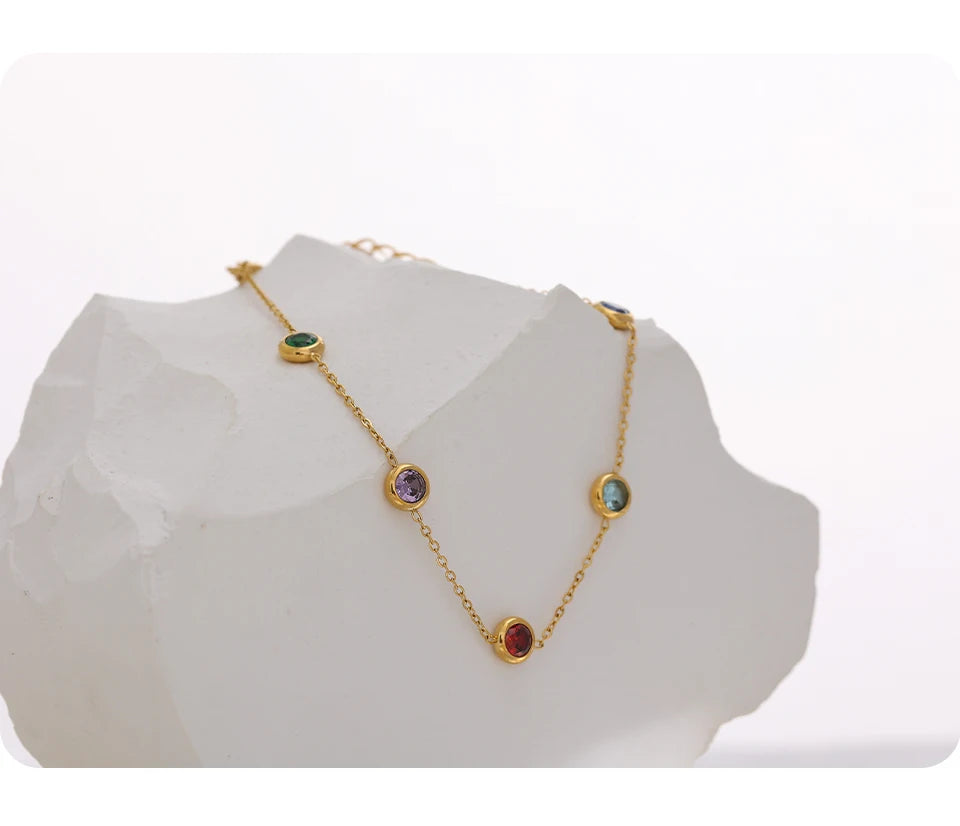 Cubic zirconia multi-color geometric necklace in gold-plated stainless steel with cubic zirconia.
