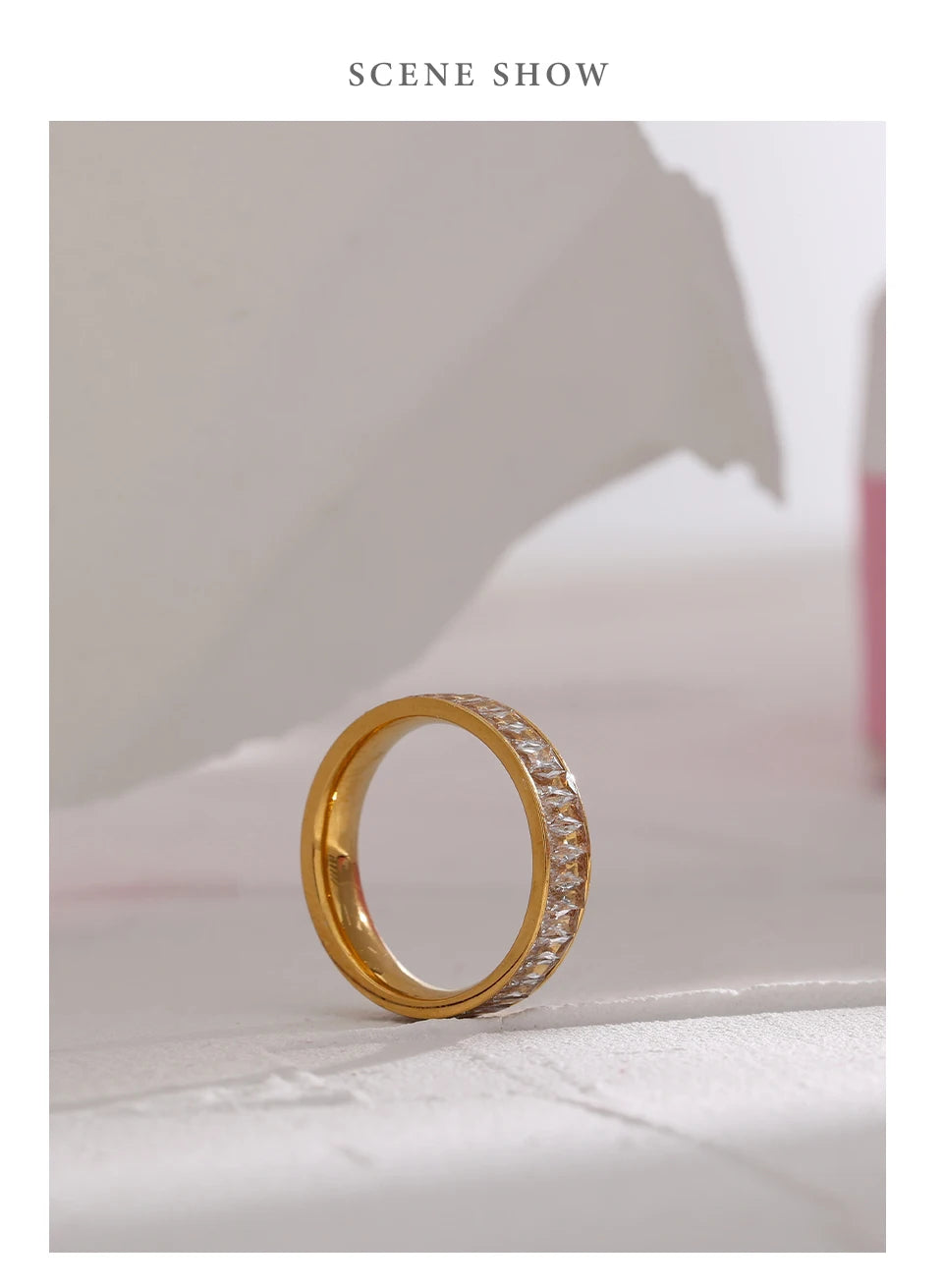 Cubic zirconia geometric ring in 18K gold-plated stainless steel with cubic zirconia.