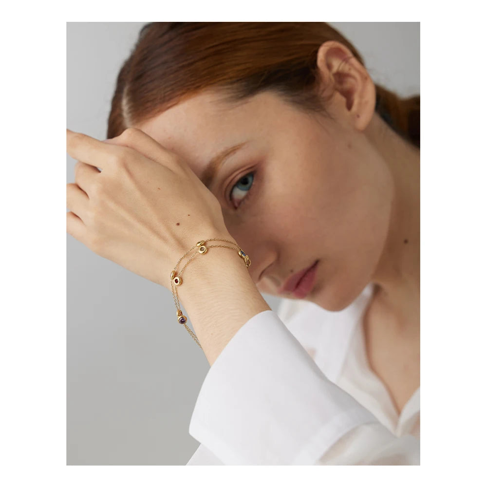 Cubic zirconia multi-color geometric necklace in gold-plated stainless steel with cubic zirconia.
