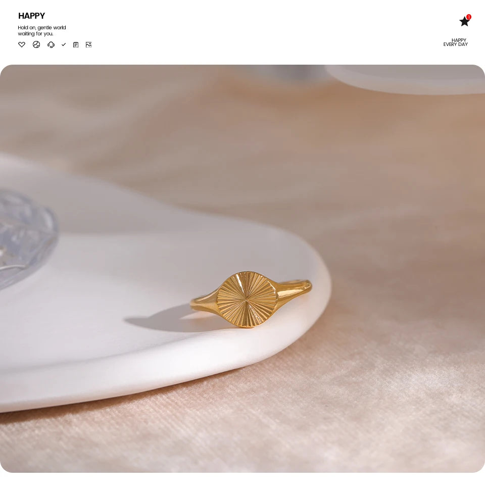 Geometric ring in gold-plated stainless steel.
