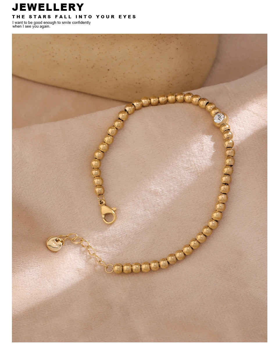 Cubic Zirconia Beaded Geometric Bracelet — Gold-Plated Stainless Steel with Cubic Zirconia · PS1573