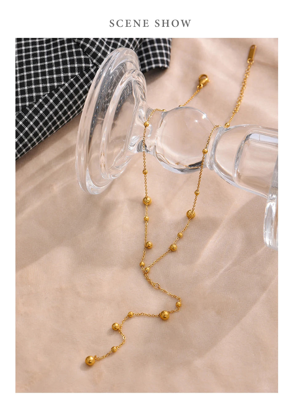 Beaded necklace in gold-plated stainless steel.